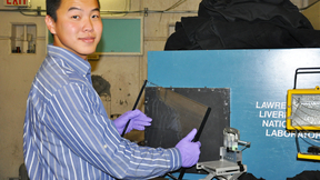 Han Wang holding thick plastic scintillator used to form the neutron radiograph