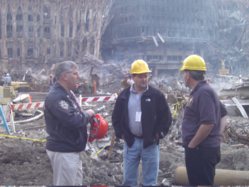 Mike Carter talks with first responders at ground zero