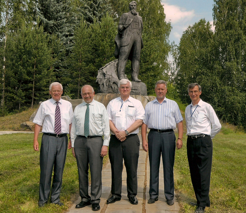 Group in front of statue in city of Snehzinsk